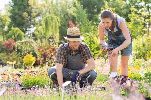 Local gardeners in Cranham working on a well-kept residential garden