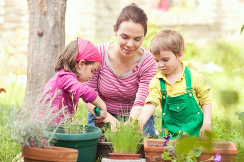 Gardeners wearing PPE while carrying out maintenance